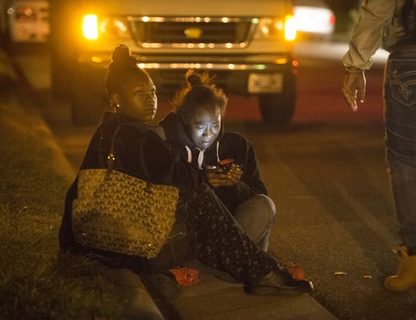 A young woman was overcome with emotion after a fatal shooting occurred near Earl Street and York Avenue in St. Paul. ] (AARON LAVINSKY/STAR TRIBUNE) 