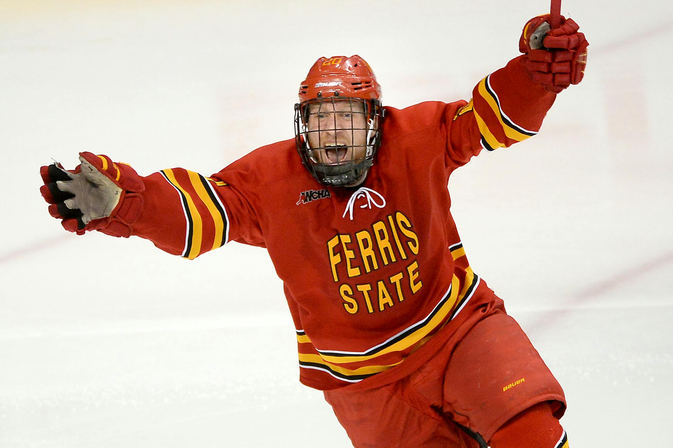 Ferris State Bulldogs forward Gerald Mayhew (20) celebrated after a rebounded shot by forward Jared VanWormer (17) made it past St. Cloud State Huskies goalie Charlie Lindgren (35) for a goal in overtime, ending the game Saturday. ] (AARON LAVINSKY/STAR TRIBUNE) aaron.lavinsky@startribune.com St. Cloud State University played Ferris State in the first round of the 2016 NCAA Division I Men's West Regional Hockey Tournament on Saturday, March 26, 2016 at Xcel Energy Center in St. Paul.