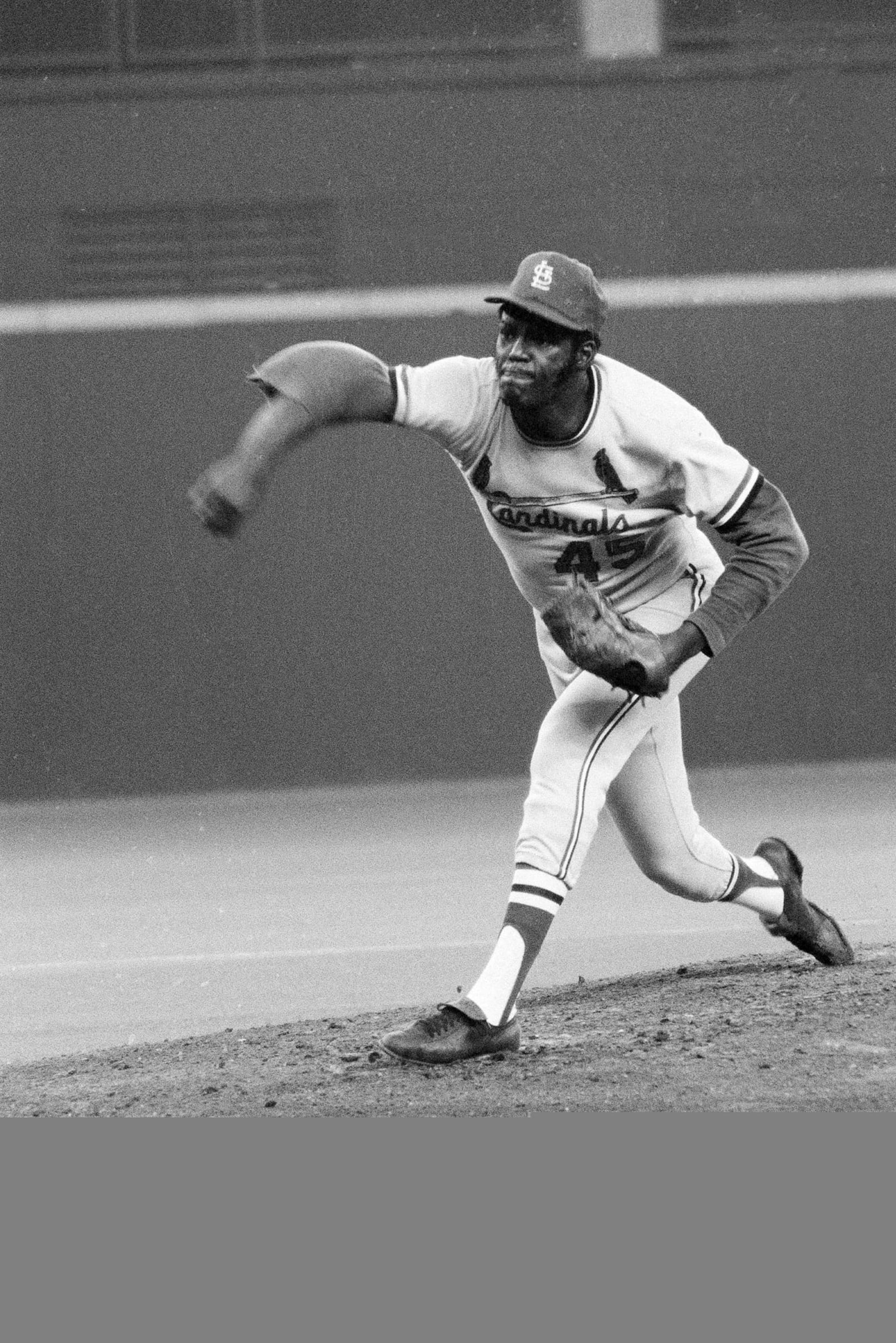 35-year-old Bob Gibson of the St. Louis Cardinals pitches against the Cincinnati Reds at Riverfront Stadium in Cincinnati, Ohio, Aug. 18, 1971. Gibson was no match for Red's pitcher, 20-year-old Don Gullett, who shutout the Cardinals 5-0 on a seven hitter, while Gibson allowed 12 hits and was knocked out. (AP Photo/Gene Smith) ORG XMIT: APHS455981