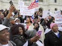 Hundreds of Twin Cities Liberians gathered on the steps of the state Capitol for a rally in support of extending a federal deportation reprieve progra
