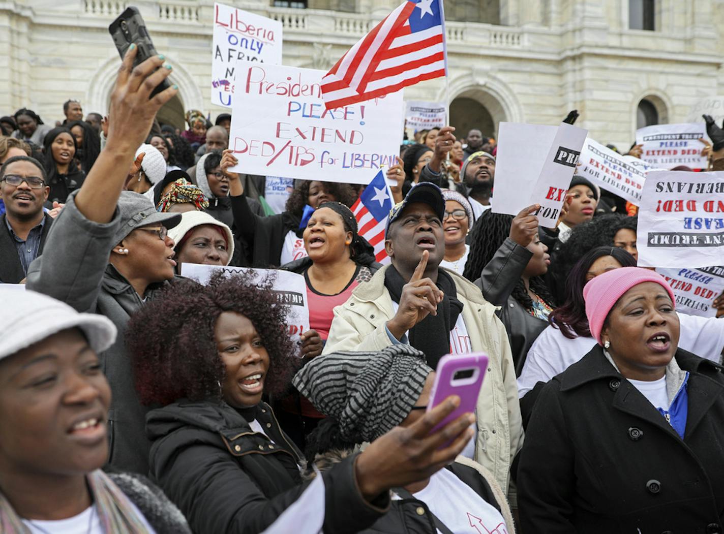 Hundreds of Twin Cities Liberians gathered on the steps of the state Capitol for a rally in support of extending a federal deportation reprieve program for Liberian natives called Deferred Enforced Departure, or DED. The program is slated to expire at the end of this month. Eight of 10 members of Minnesota's congressional delegation wrote to President Trump urging him to extend it. BRIAN PETERSON &#x2022; brian.peterson@startribune.com
St. Paul, MN 03/26/18