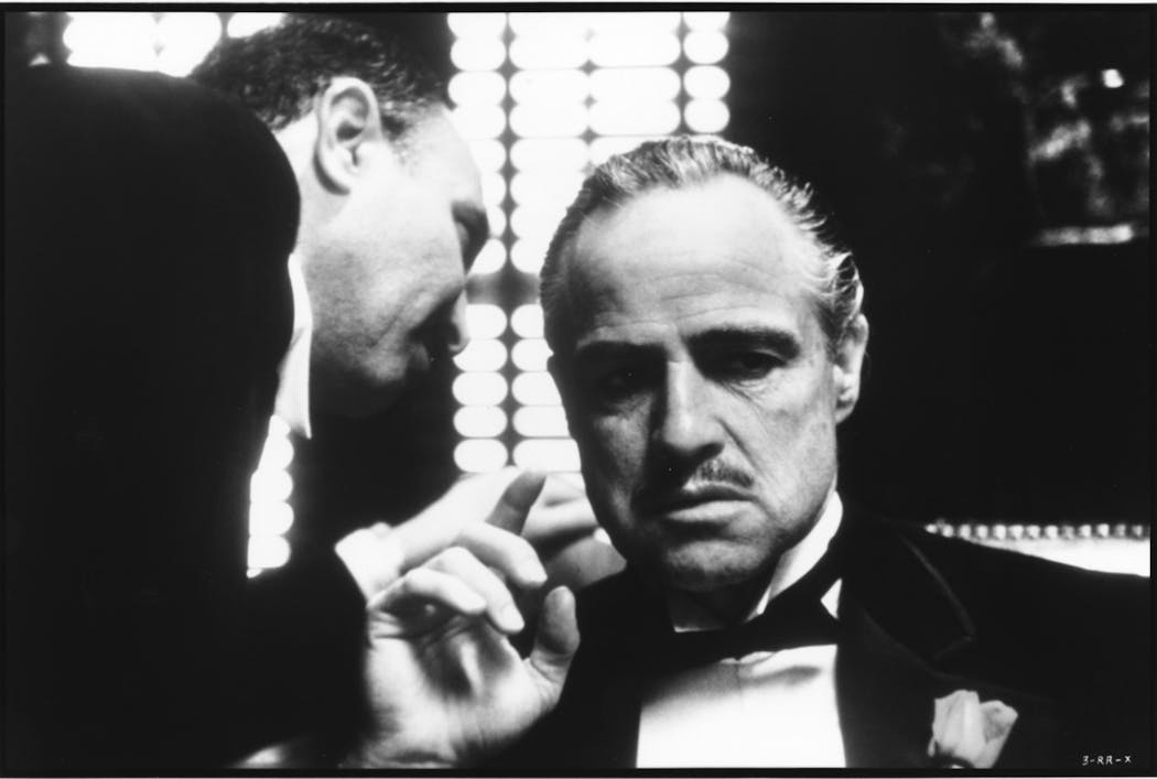 Marlon Brando (at right) stars as Don Vito Corleone, and Salvatore Corsitto (left) as undertaker Bonasera in the 1972 movie classic 