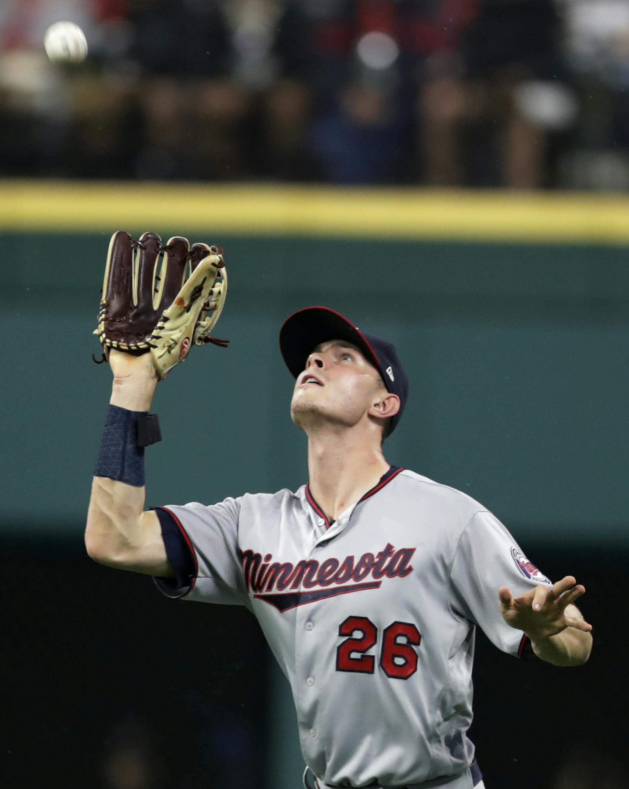 Minnesota Twins' Max Kepler catches a ball hit by Cleveland Indians' Edwin Encarnacion during the first inning of a baseball game Tuesday, Aug. 7, 2018, in Cleveland. (AP Photo/Tony Dejak)