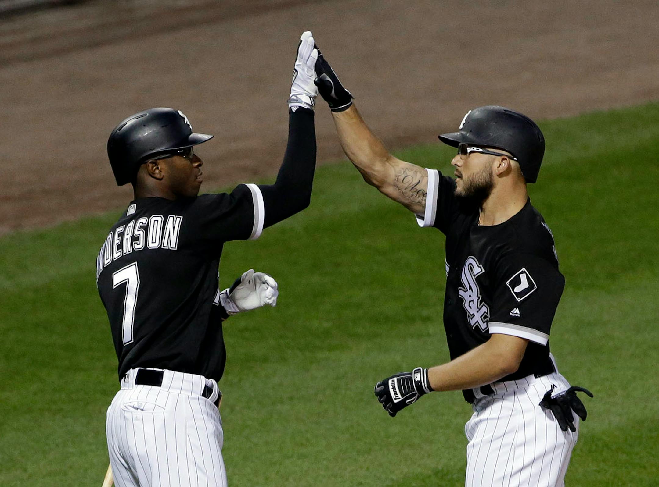 Chicago White Sox's Yolmer Sanchez, right, celebrates with Tim Anderson after hitting a solo home run during the second inning of a baseball game against the Minnesota Twins, Thursday, Aug. 24, 2017, in Chicago.