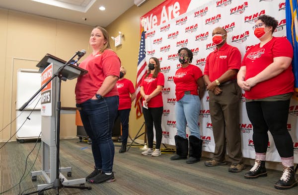 Angela Becchetti, a registered nurse from Abbott Northwestern- Alina, speaks at a press conference announcing the intent for the nurses to strike Thur