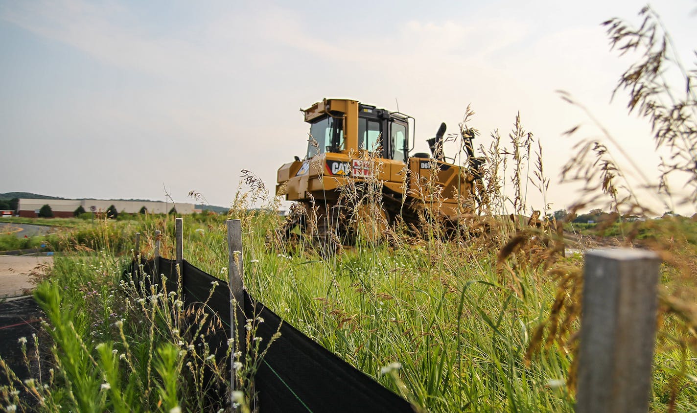 A bulldozer sits in an empty lot just north of a Home Depot and east of the Walmart/Sam&#x2019;s Club shopping area in Shakopee that is set to become a 10-screen Marcus theater.