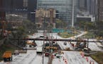 Construction on Interstate 35W south of downtown Minneapolis ;has traffic closed on the freeway all the way south to HWY 62..] Richard Tsong-Taatarii/