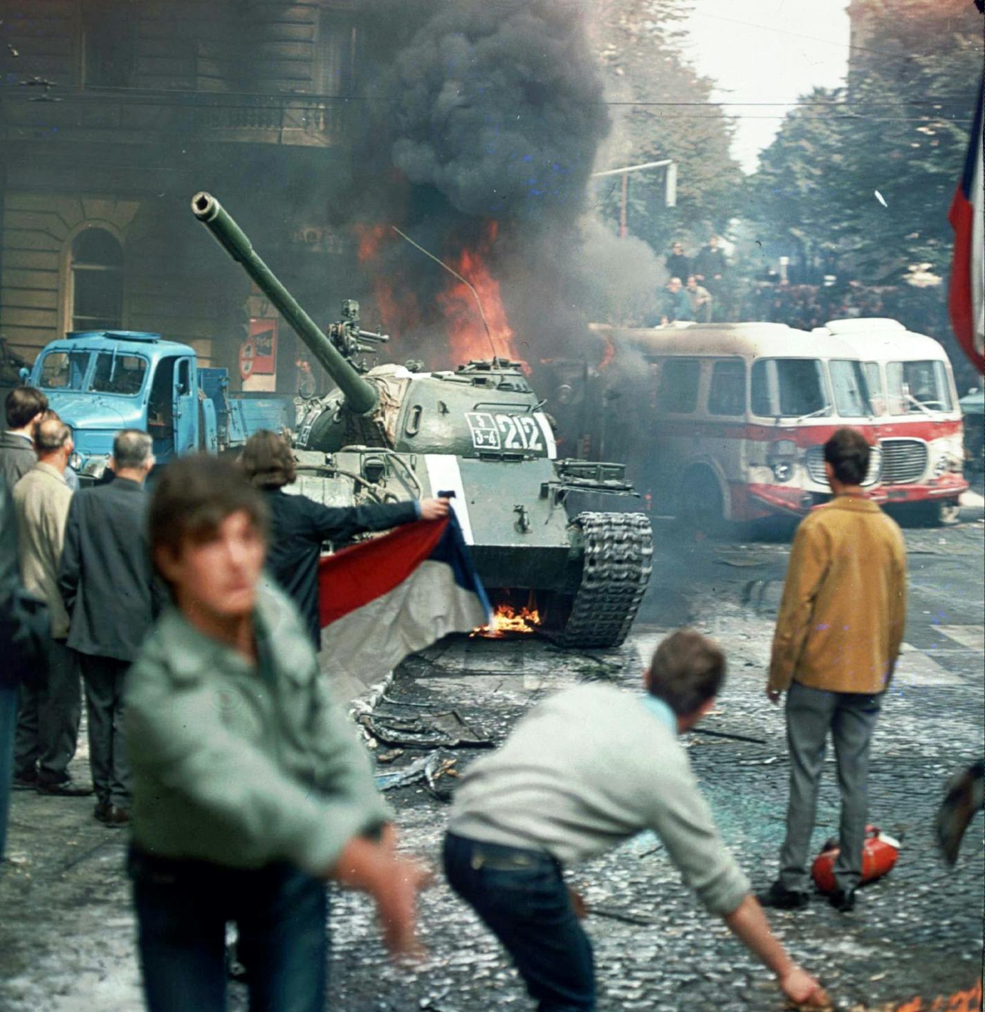 ** FILE ** In this Aug. 21,1968 file picture, Prague residents carrying a Czechoslovakian flag and throwing burning torches, attempt to stop a Soviet tank in downtown Prague, Czechoslovakia as the Soviet-led invasion by the Warsaw Pact armies crushed the so-called Prague Spring reforms. In August 2008, the ex-communist country will mark the 40th anniversary of the Prague Spring challenge to Soviet domination - bold pro-democracy reforms that the Kremlin swiftly and brutally crushed. Experts say