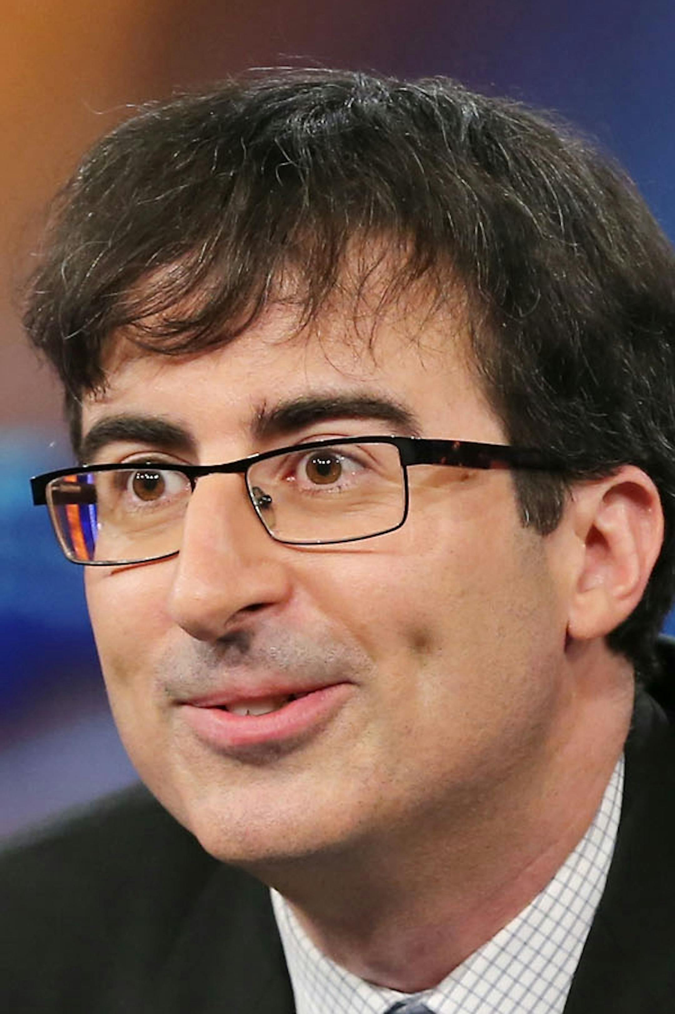 NEW YORK, NY - JUNE 10: John Oliver takes over as summer guest host of "The Daily Show with Jon Stewart" on June 10, 2013 in New York City. (Photo by Neilson Barnard/Getty Images for Comedy Central)