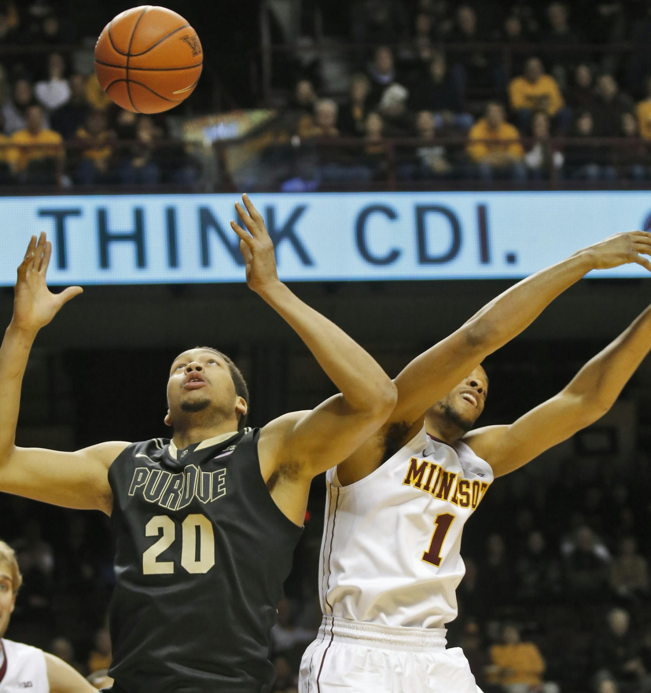 Minnesota Gophers mens basketball vs. Purdue. Purdue's A.J. Hammons (20) grabbed a rebound away from Minnesota's Andre Hollins. (MARLIN LEVISON/STARTRIBUNE