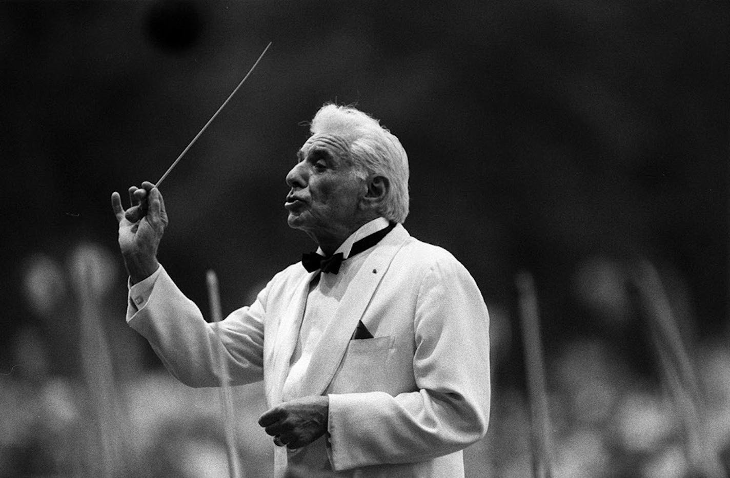 Leonard Bernstein conducts the New York Philharmonic Orchestra in Central Park, August 1986.