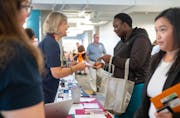 Raissa Akoh spoke with job recruiters Wednesday during the third annual Veterans & Community Job Fair at the CareerForce Building in Minneapolis. The 