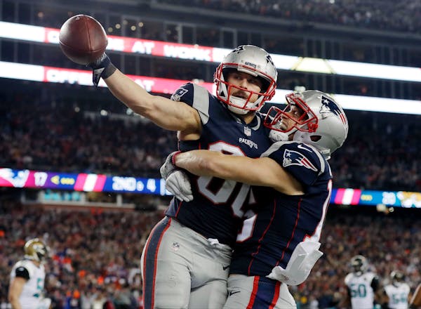 New England Patriots wide receiver Danny Amendola, left, celebrates his touchdown catch with Chris Hogan, right, during the second half of the AFC cha