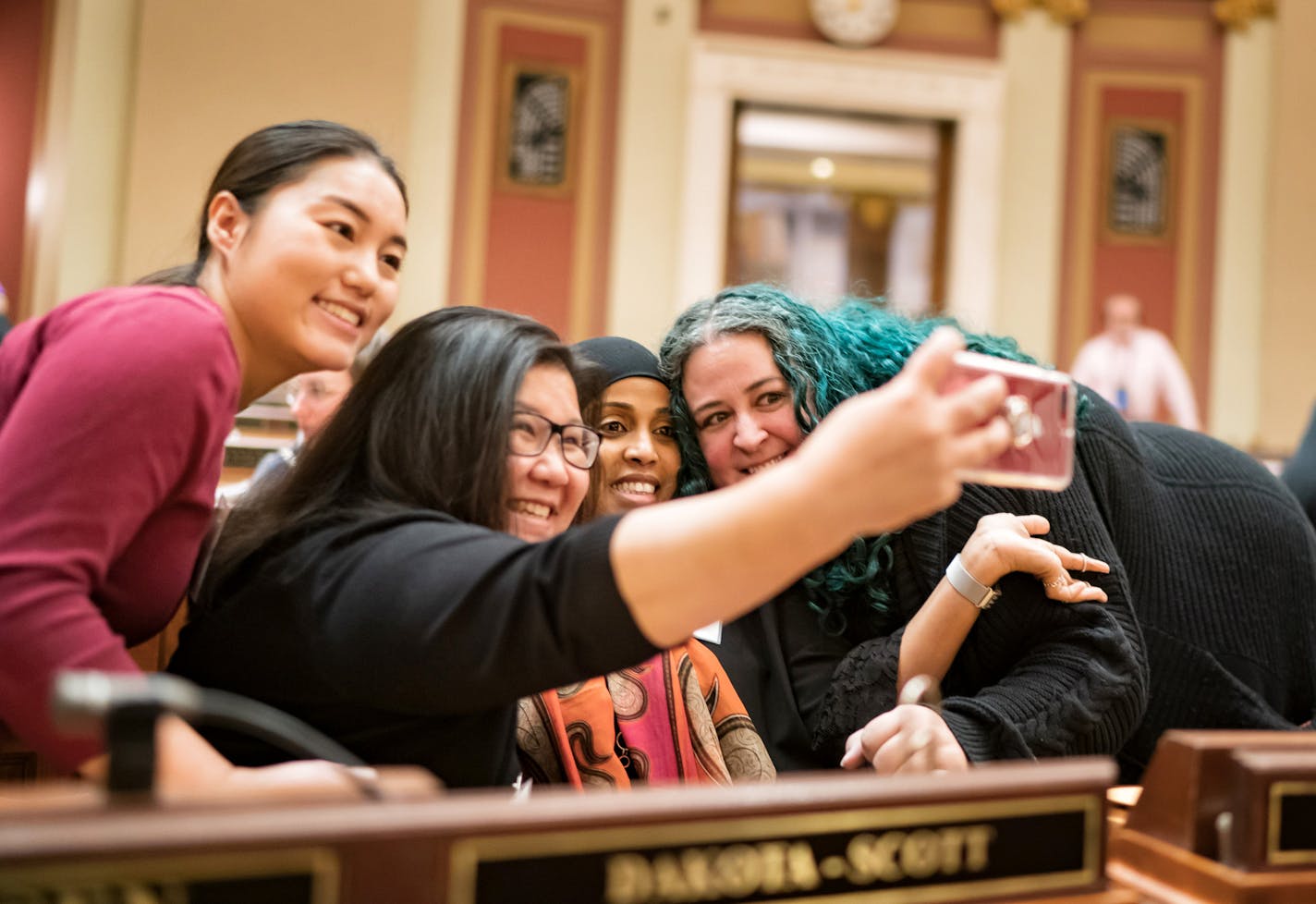 From left, new DFL Reps.-elect Samantha Vang of Brooklyn Center, Kaohly Her of St. Paul, Hodan Hassan of Minneapolis and Aisha Gomez of Minneapolis got together for a photo Wednesday before their freshman orientation in the House chamber at the State Capitol.