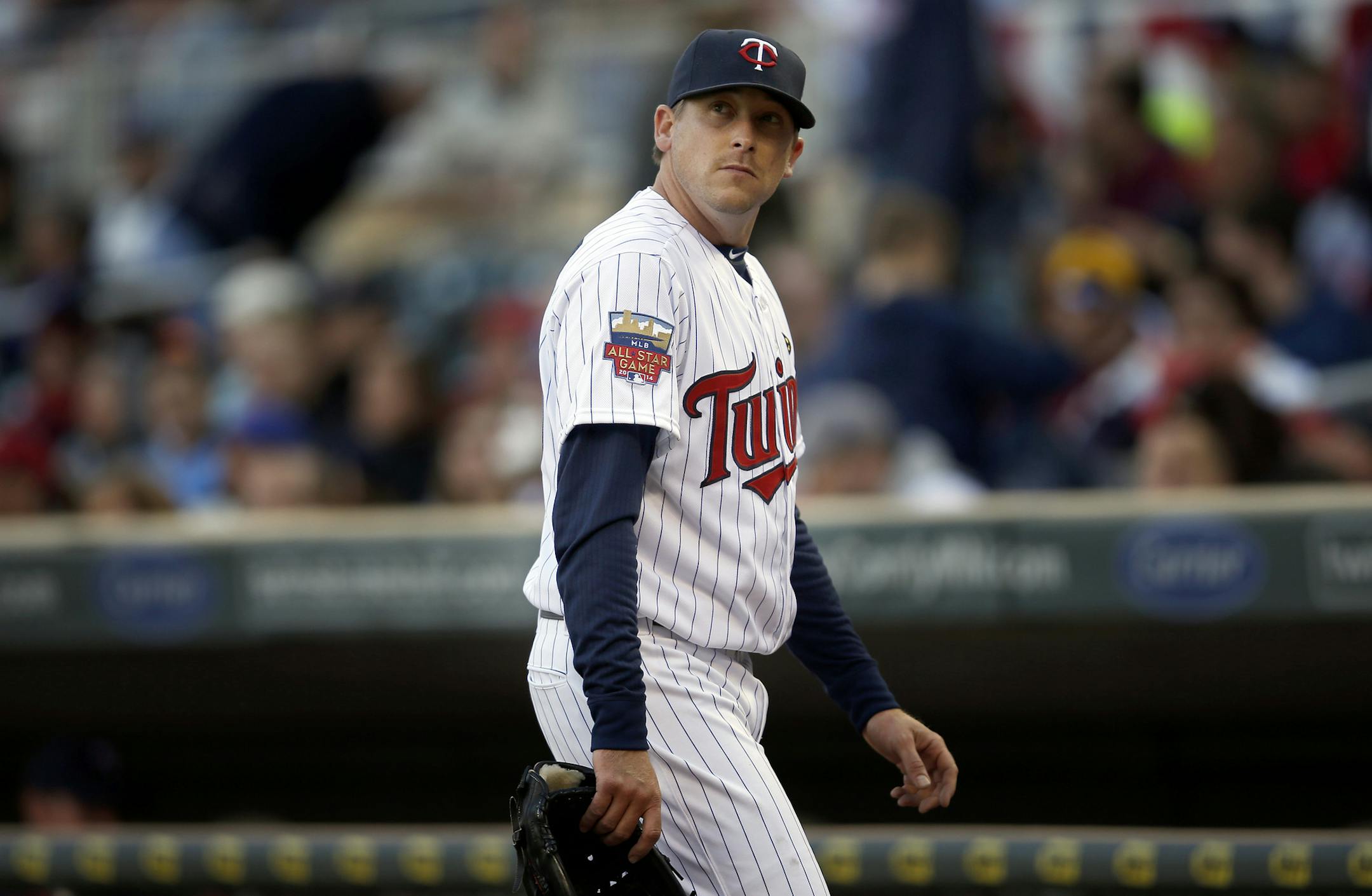 Minnesota Twins starting pitcher Kevin Correia (30) walked to the dugout after being pulled out of the game in the sixth inning. ] CARLOS GONZALEZ cgonzalez@startribune.com - April 7, 2014, Minneapolis, Minn., Target Field, MLB, Minnesota Twins vs. Oakland A‚Äôs ‚Äì Twins home opener