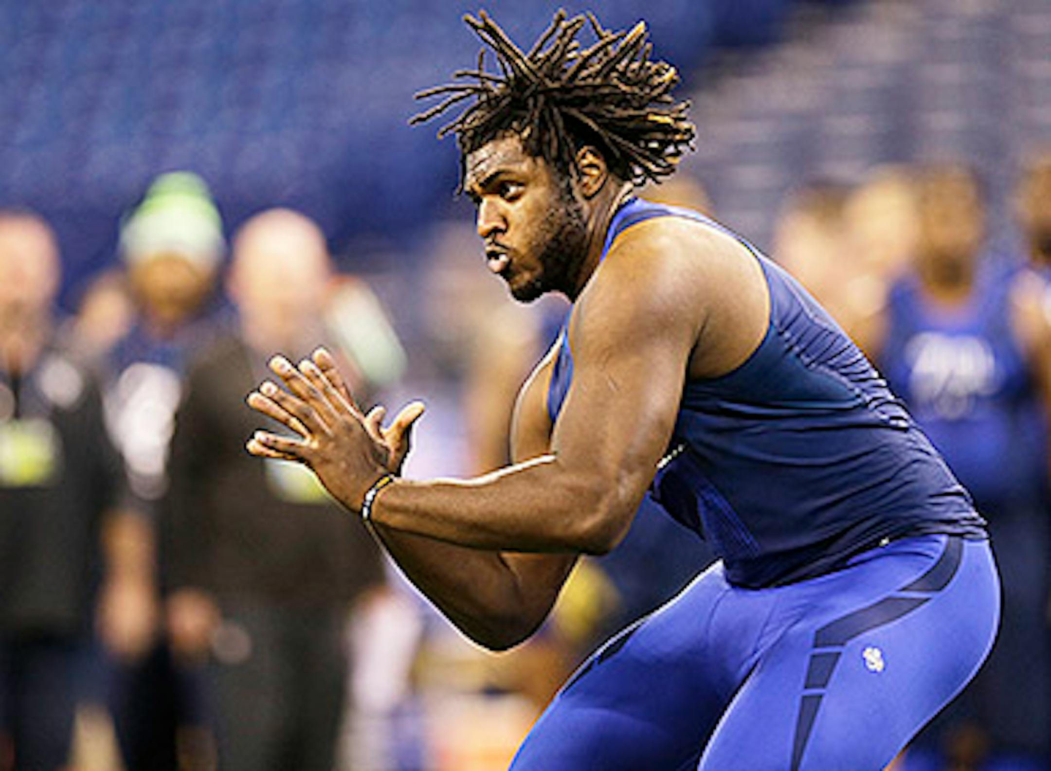 Pittsburgh offensive lineman T.J. Clemmings (6) runs a drill at the NFL football scouting combine in Indianapolis, Friday, Feb. 20, 2015. (AP Photo/David J. Phillip)