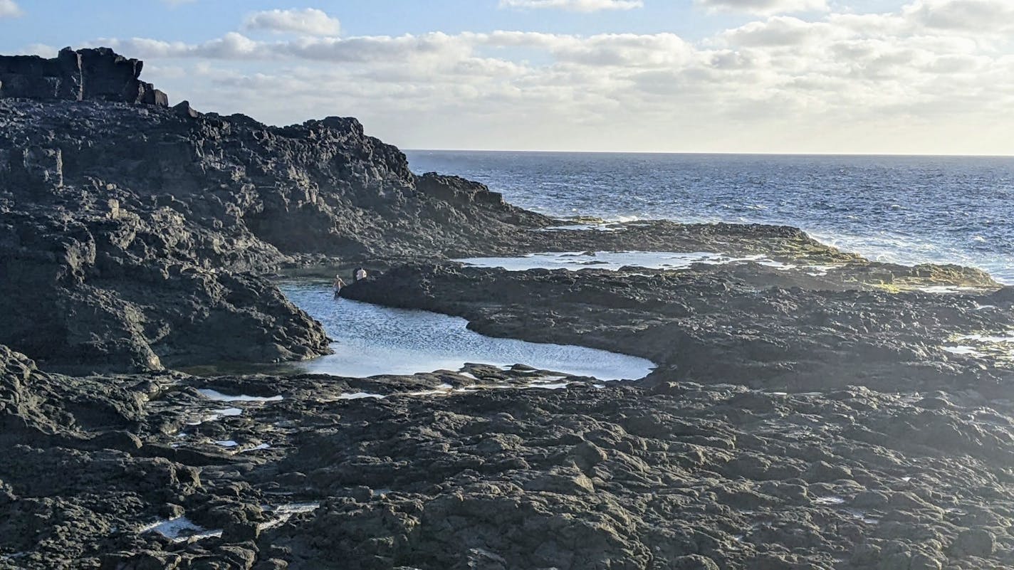 Volcanic cliffs form Los Charcones (natural pools) on the western coast of Lanzarote, Canary Islands.