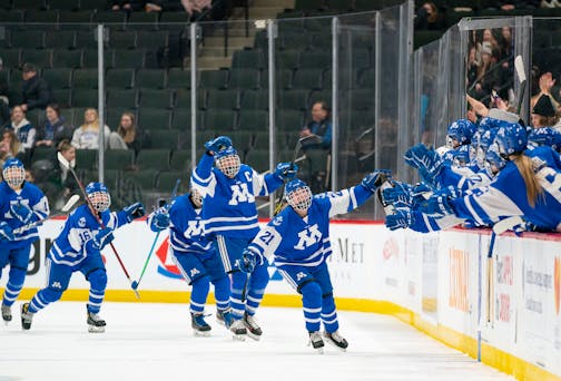 Minnetonka forward Senja Leeper (21) celebrates with her teammates after scoring a goal in the second period against Edina in the MSHSL state tournament class 2A girl's hockey semi-finals Friday, Feb. 25, 2022 at Xcel Energy Center in St. Paul, Minn. ]