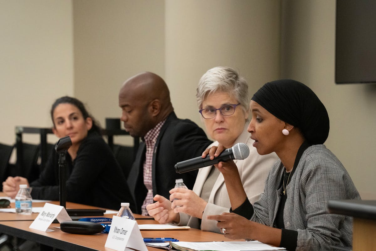 Hennepin County Attorney Mary Moriarty listened as U.S. Rep. Ilhan Omar, right, spoke during a community discussion on the impacts of marijuana legali