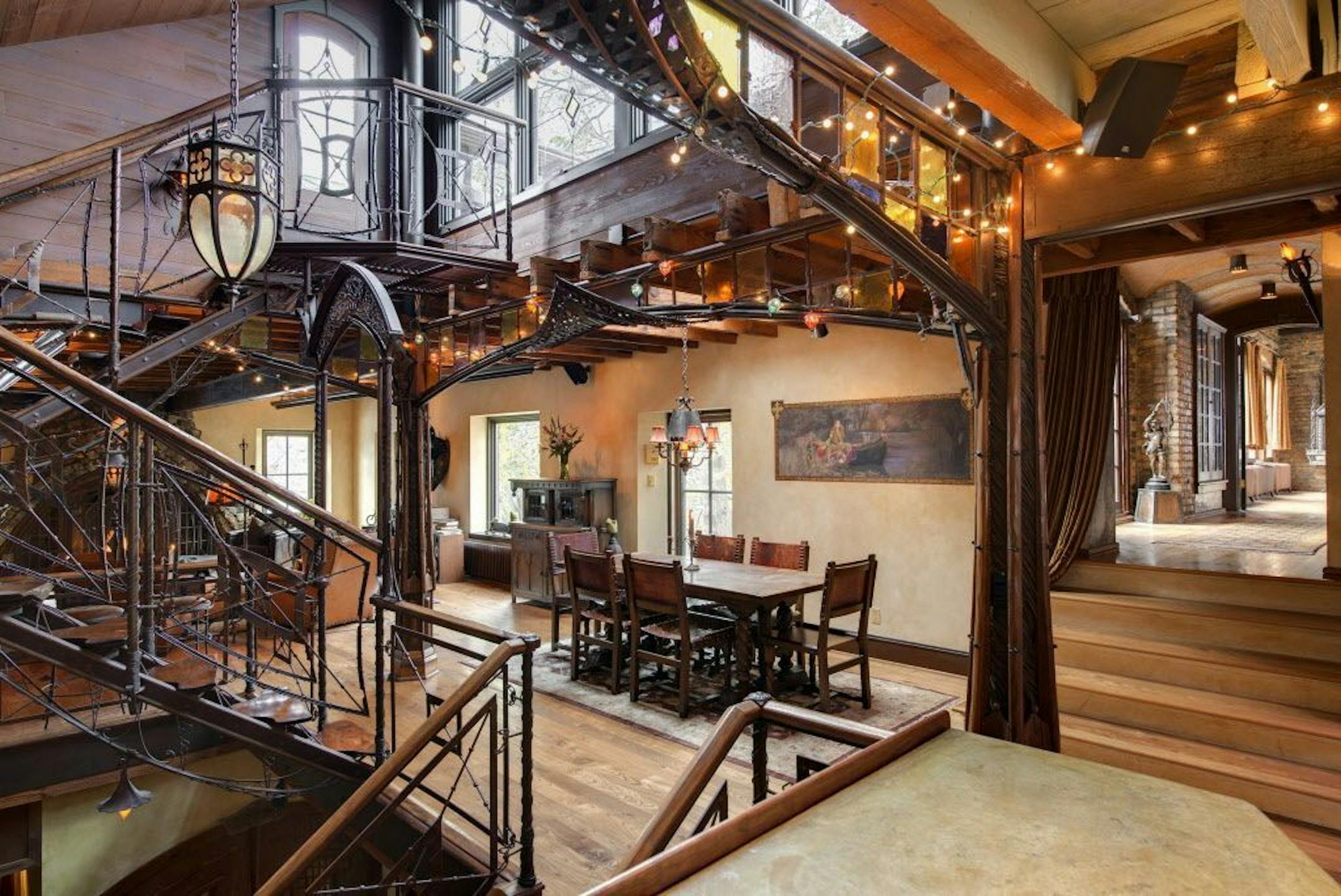 The view from the artisan metal staircase down into the dining area on the main floor.