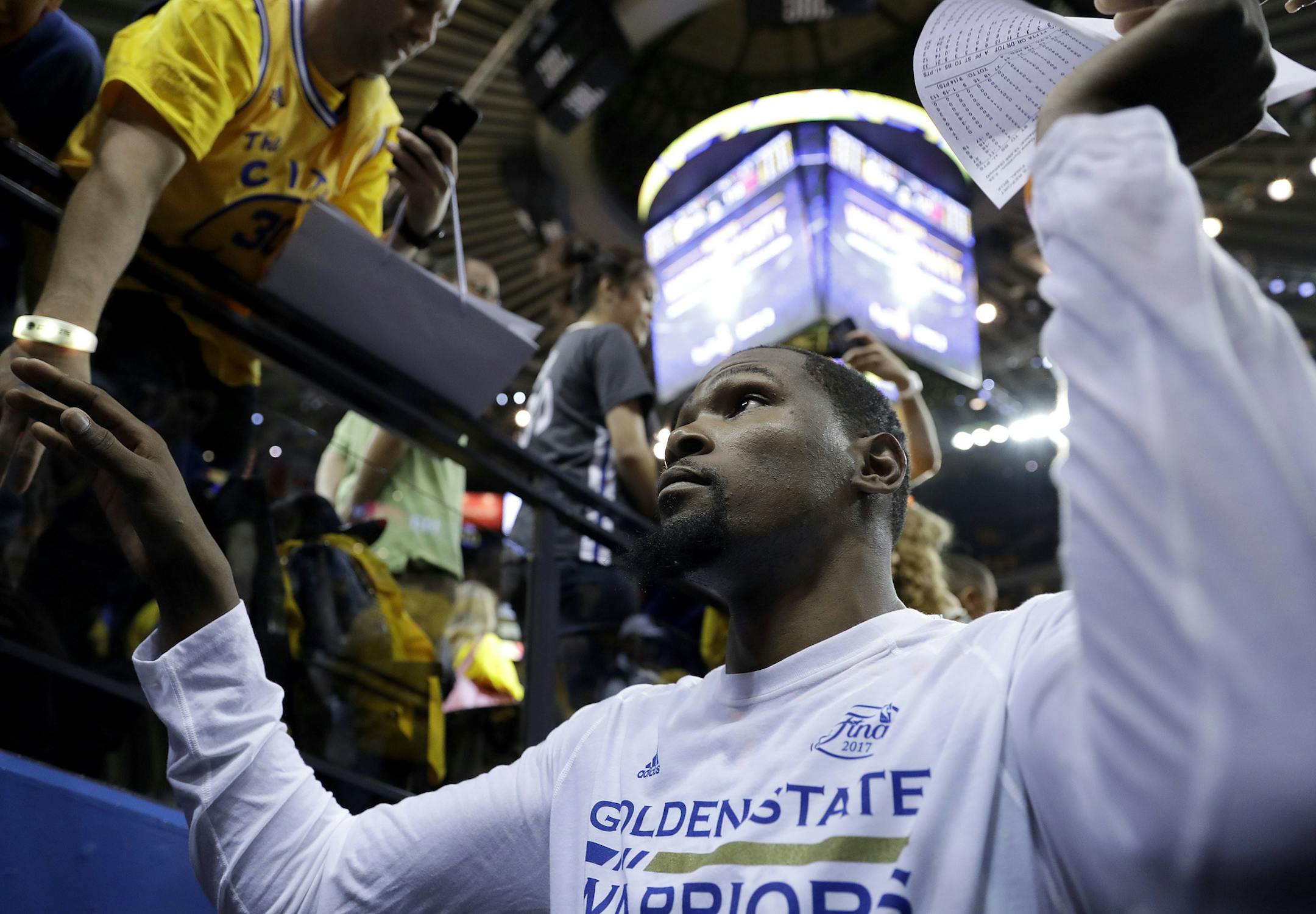Golden State Warriors forward Kevin Durant walks off the floor after Game 2 of basketball's NBA Finals against the Cleveland Cavaliers in Oakland, Calif., Sunday, June 4, 2017. (AP Photo/Marcio Jose Sanchez) ORG XMIT: OAS1