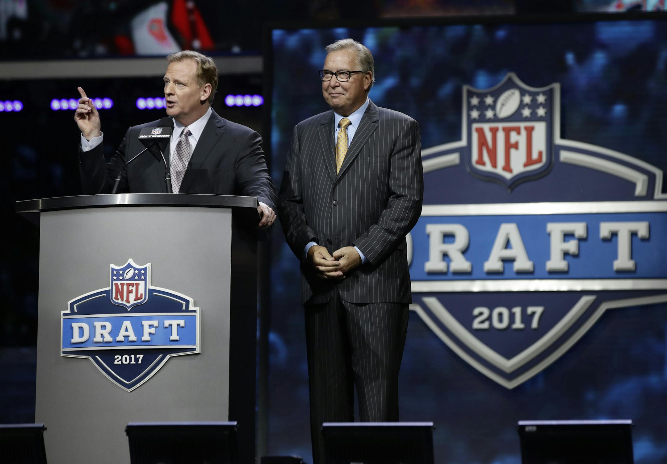 NFL commissioner Roger Goodell, left, speaks with former Philadelphia Eagles' Ron Jaworski before the second round of the 2017 NFL football draft, Friday, April 28, 2017, in Philadelphia.
