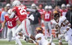 Minnesota's defensive back Jacob Huff tipped up Ohio State's running back Mike Weber during the fourth quarter as Minnesota took on Ohio State at Ohio