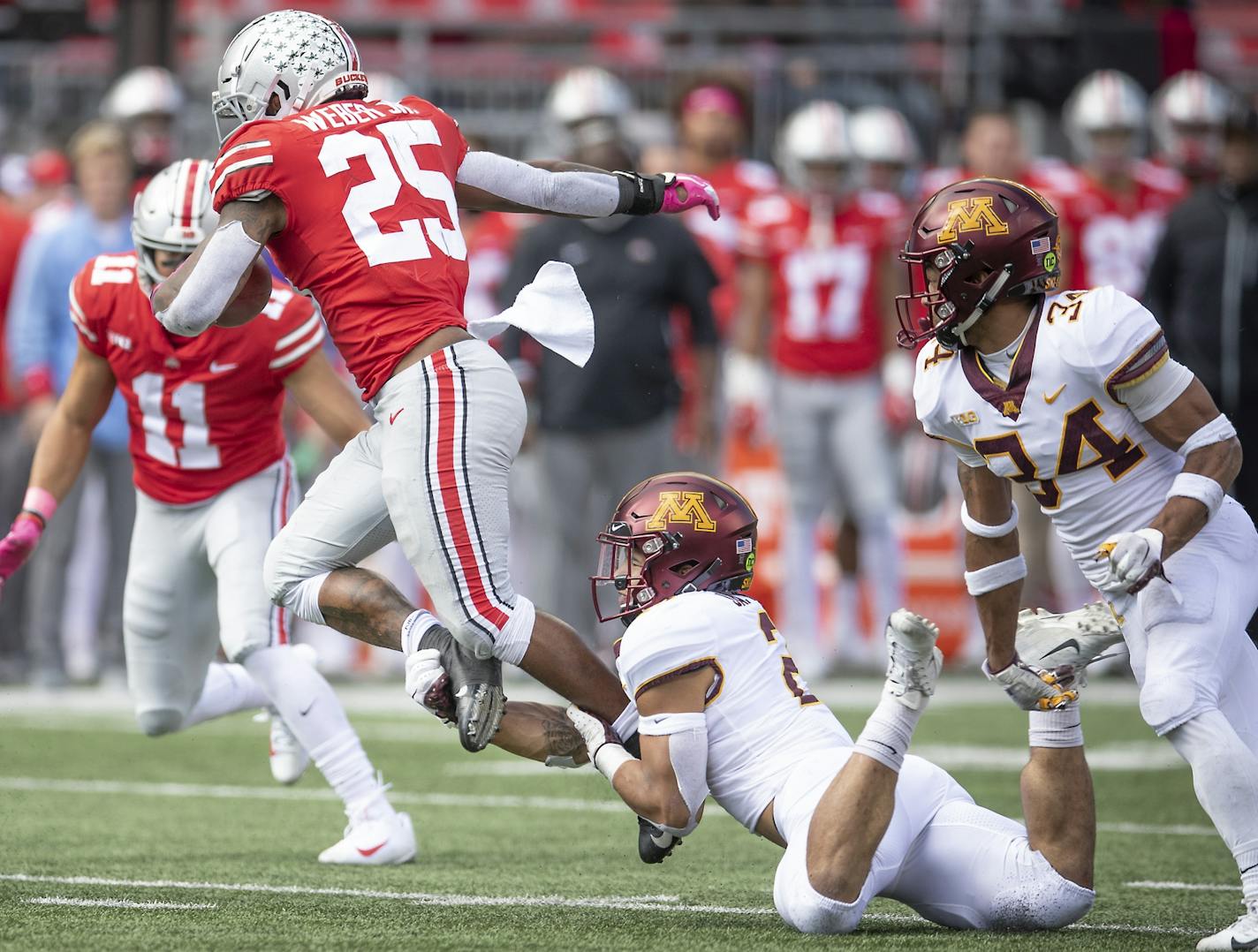 Minnesota's defensive back Jacob Huff tipped up Ohio State's running back Mike Weber during the fourth quarter as Minnesota took on Ohio State at Ohio Stadium, Saturday, October 13, 2018 in Columbus, OH.