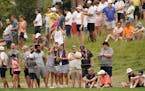 Second round coverage of the 3M Open - Crowds along the 9th fairway.