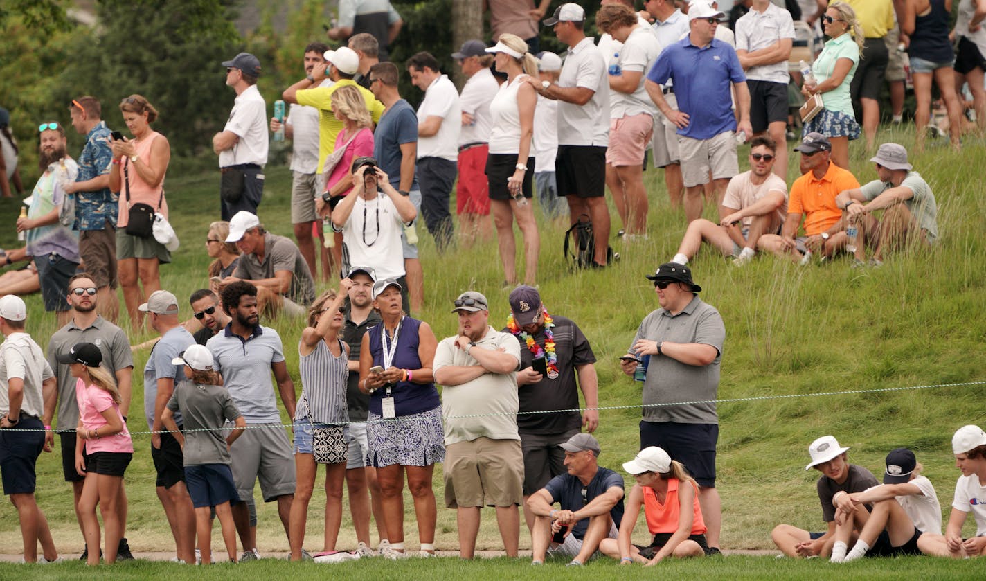 Second round coverage of the 3M Open - Crowds along the 9th fairway.