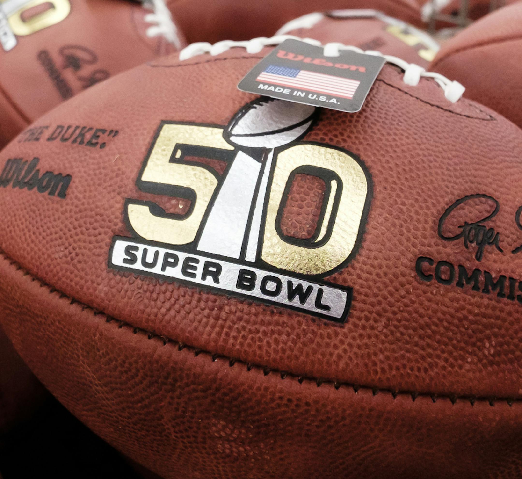 Official balls for the NFL Super Bowl 50 football game are seen in a bin prior to final inspection at the Wilson Sporting Goods Co. in Ada, Ohio, Tuesday, Jan. 26, 2016. The Denver Broncos will play the Carolina Panthers in the Super Bowl on Feb. 7 in Santa Clara, CA. (AP Photo/Rick Osentoski)
