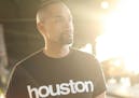 photo of author Michael Arceneaux in a "Houston" t-shirt