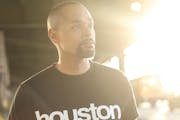 photo of author Michael Arceneaux in a "Houston" t-shirt