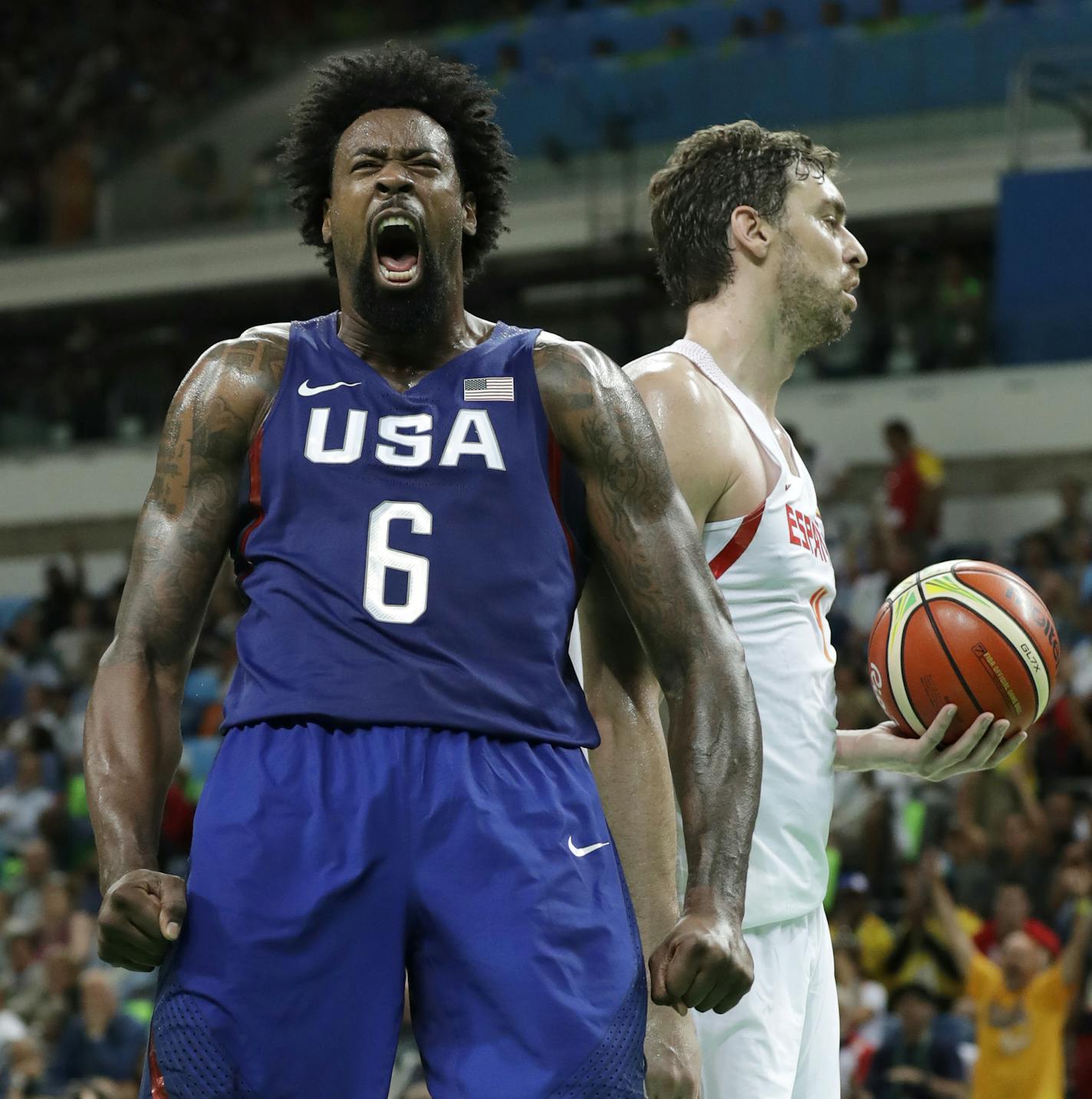 United States' DeAndre Jordan (6) celebrates in front of Spain's Pau Gasol, right, after dunking the ball during a semifinal round basketball game at the 2016 Summer Olympics in Rio de Janeiro, Brazil, Friday, Aug. 19, 2016. (AP Photo/Charlie Neibergall)