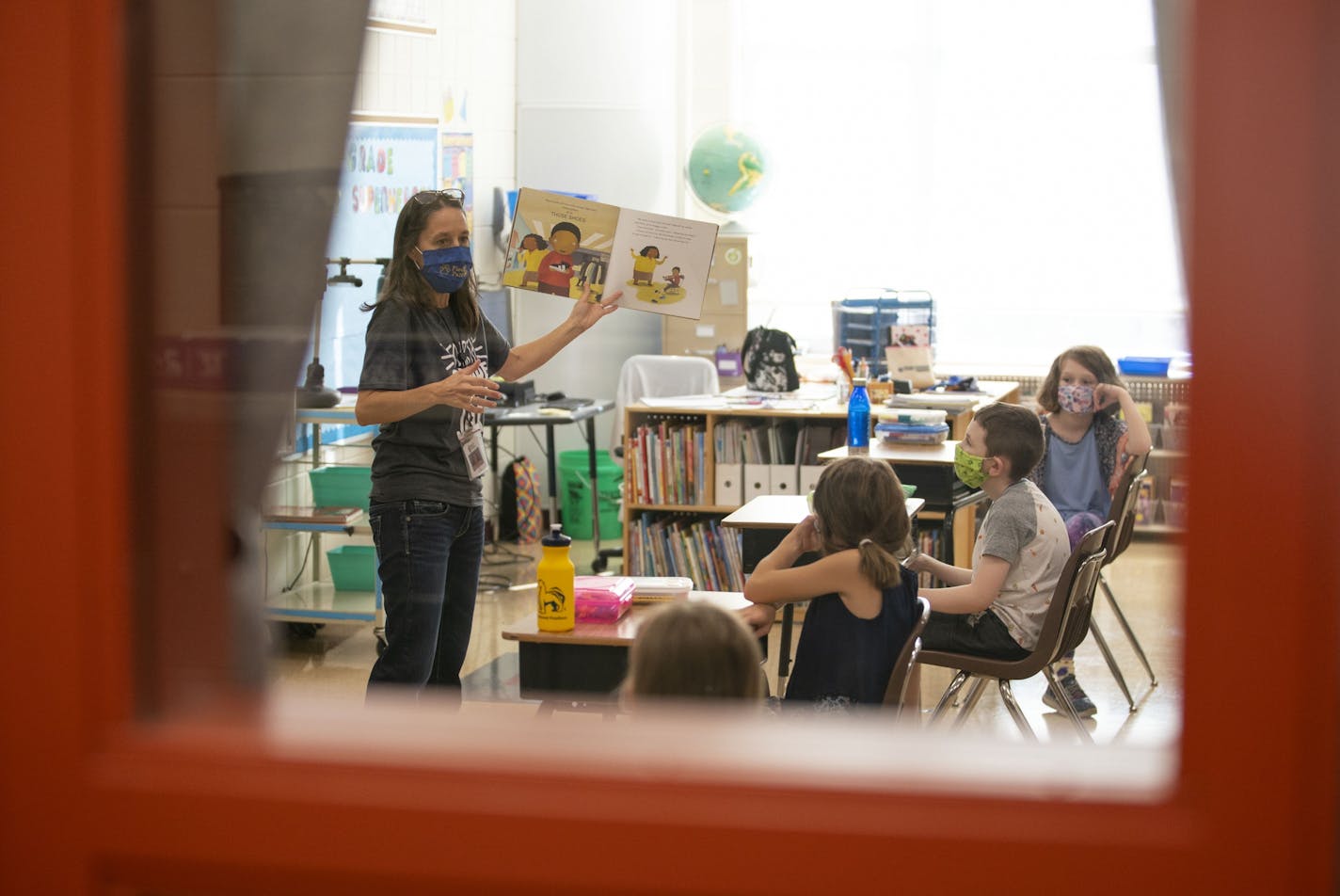 Lisa Larson read a book to her students on the first day of in-person class at Piedmont Elementary School on Sept. 21. Lisa Larson read a book to her students on the first day of in-person class at Piedmont Elementary School on Sept. 21. Duluth Public Schools told parents this week that students will remain in distance learning at least until the end of the first semester, which wraps up Jan. 21.