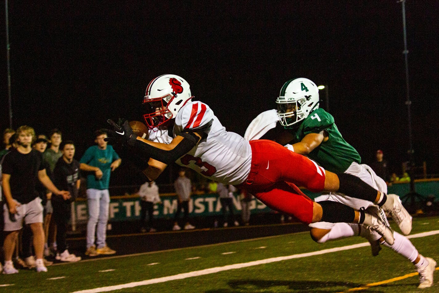 Stillwater wide receiver Tanner Schmidt (3) scores a game-winning touchdown in the last two minutes of a Mounds View game against Stillwater Friday, Sept. 22, 2023 at Mounds View High School.