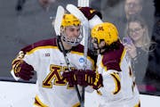 Gophers freshman Jimmy Clark, left, celebrates after scoring off a pass from Connor Kurth, right, in Thursday's NCAA regional semifinal in Sioux Falls