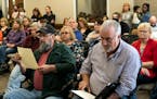 Community members prepared to speak in opposition to the Community for All resolution at the Marathon County Courthouse in Wausau, Wis., on May 13, 20
