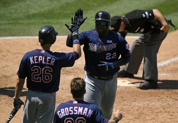 The Twins&#x2019; Miguel Sano, right, was congratulated by Max Kepler, left, and Robbie Grossman after hitting a two-run homer during the sixth inning