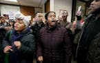 Jamar Clark supporters rallied in District Attorney Mike Freeman's office for a "Freeman Friday," at the Hennepin County Government Center, Friday, Fe