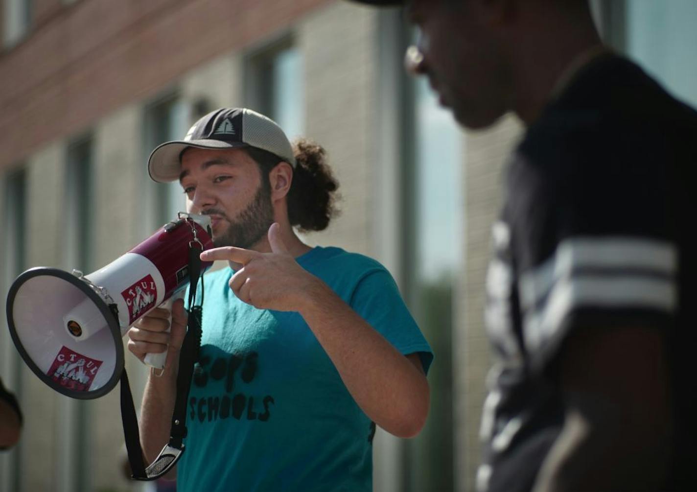 Colin Robinson, a senior this fall at Southwest H.S. voiced his opposition to police presence in Minneapolis schools to supporters .