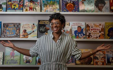 Local writer and anthropologist Nicole Nfonoyim-Hara poses on June 20 in front of a bookshelf inside the creative hub she is launching to amplify Blac