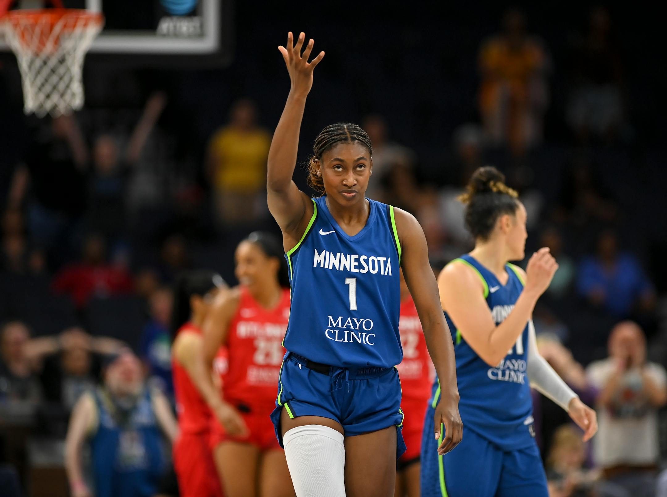 Minnesota Lynx guard Diamond Miller reacts after an offensive foul call in the final minute of a game.