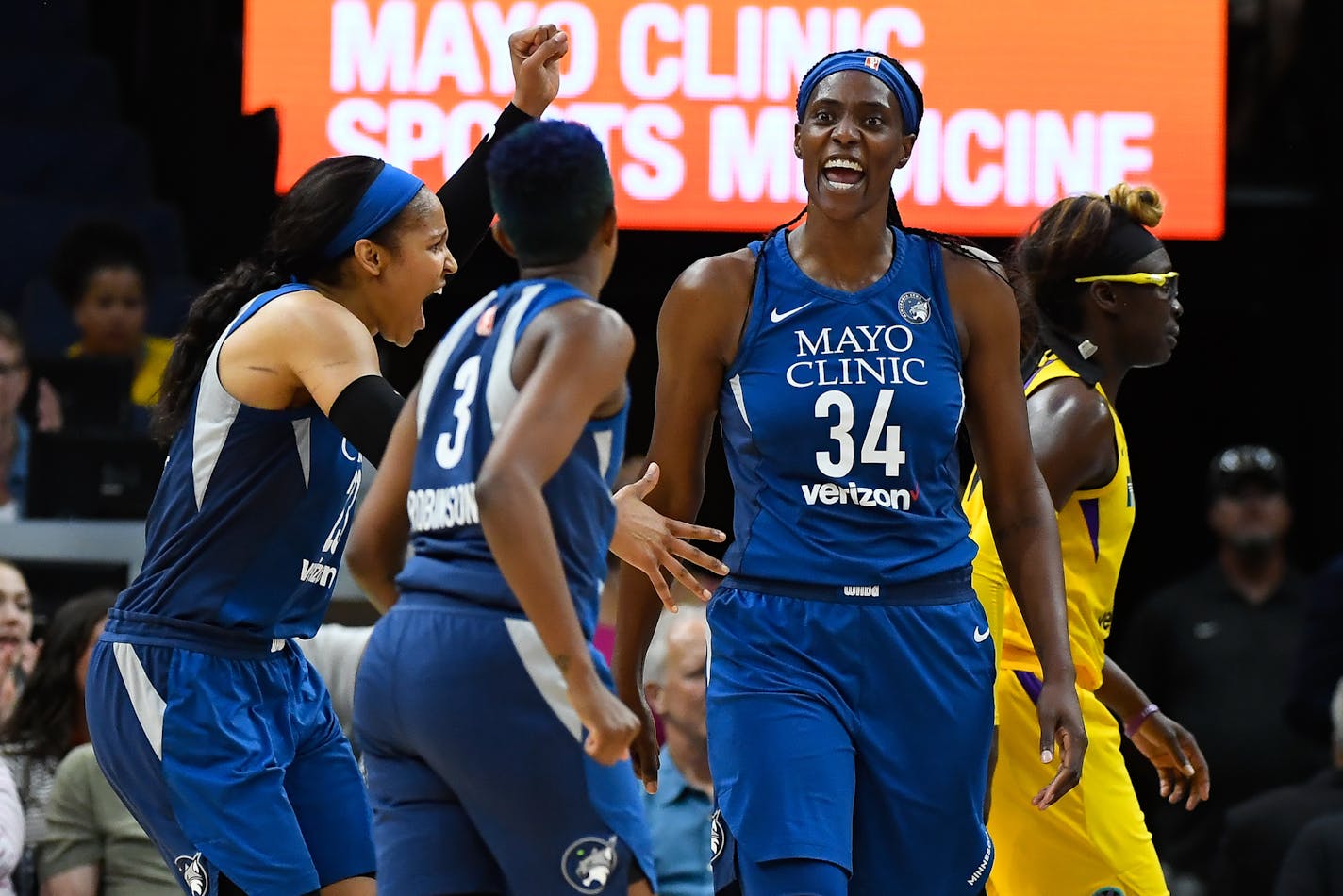 Minnesota Lynx forward Maya Moore (23), guard Danielle Robinson (3) and center Sylvia Fowles (34) celebrate a basket with an and-one opportunity, scored by Fowles in the second quarter against the Los Angeles Sparks on Thursday, July 5, 2018, at Target Center in Minneapolis. (Aaron Lavinsky/Minneapolis Star Tribune/TNS)