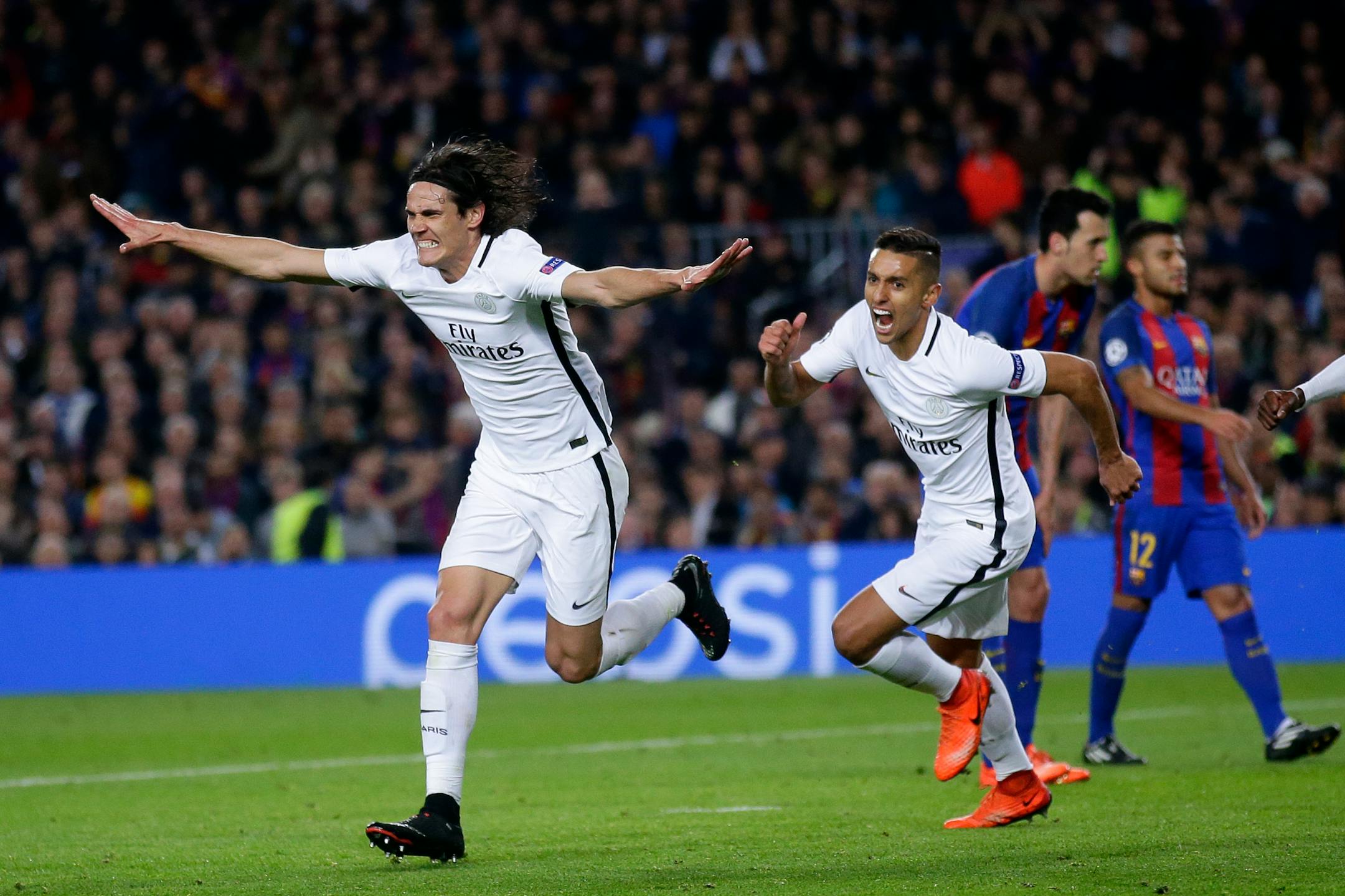 Paris Saint-Germain's Edinson Cavani, left, celebrates after scoring in a loss to FC Barcelona on Wednesday.
