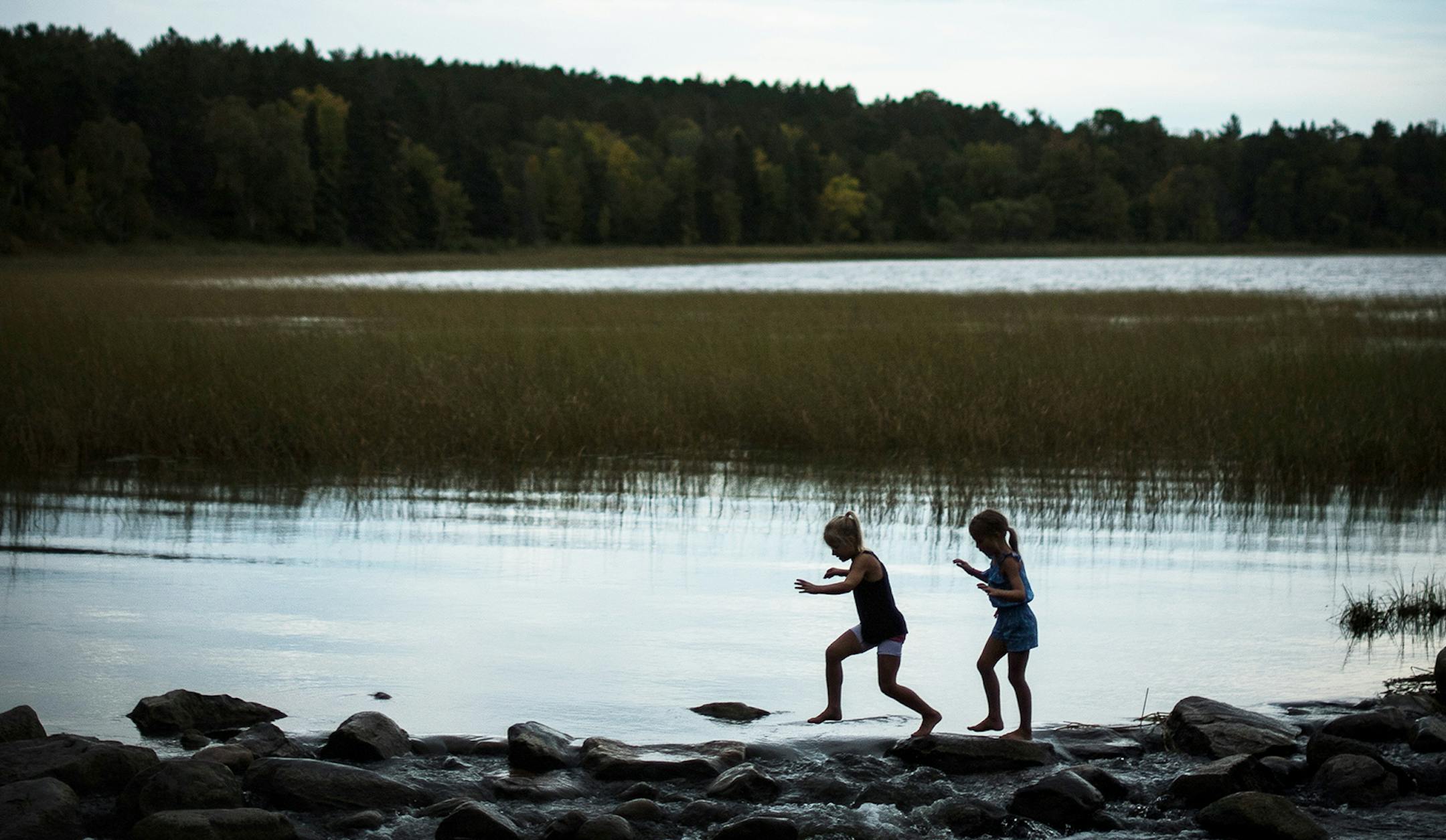 Lidia Ravaska, 8, left, and her sister Gabriella, 7, of Dassel Cokato, played on the rocks at the Mississippi Headwaters in Itasca State Park on Sunday, Sept. 18 2016. ] (AARON LAVINSKY/STAR TRIBUNE) aaron.lavinsky@startribune.com RIVERS PROJECT: We look at three of Minnesota's rivers, including the Mississippi, Red and Chippewa, to see how land use effects water quality and pollution. ORG XMIT: MIN1609182237560891