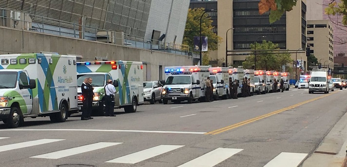 Ambulances provided a procession in downtown Minneapolis for the body of Marina DeStano Challeen, who died while on duty Monday in an interstate crash.