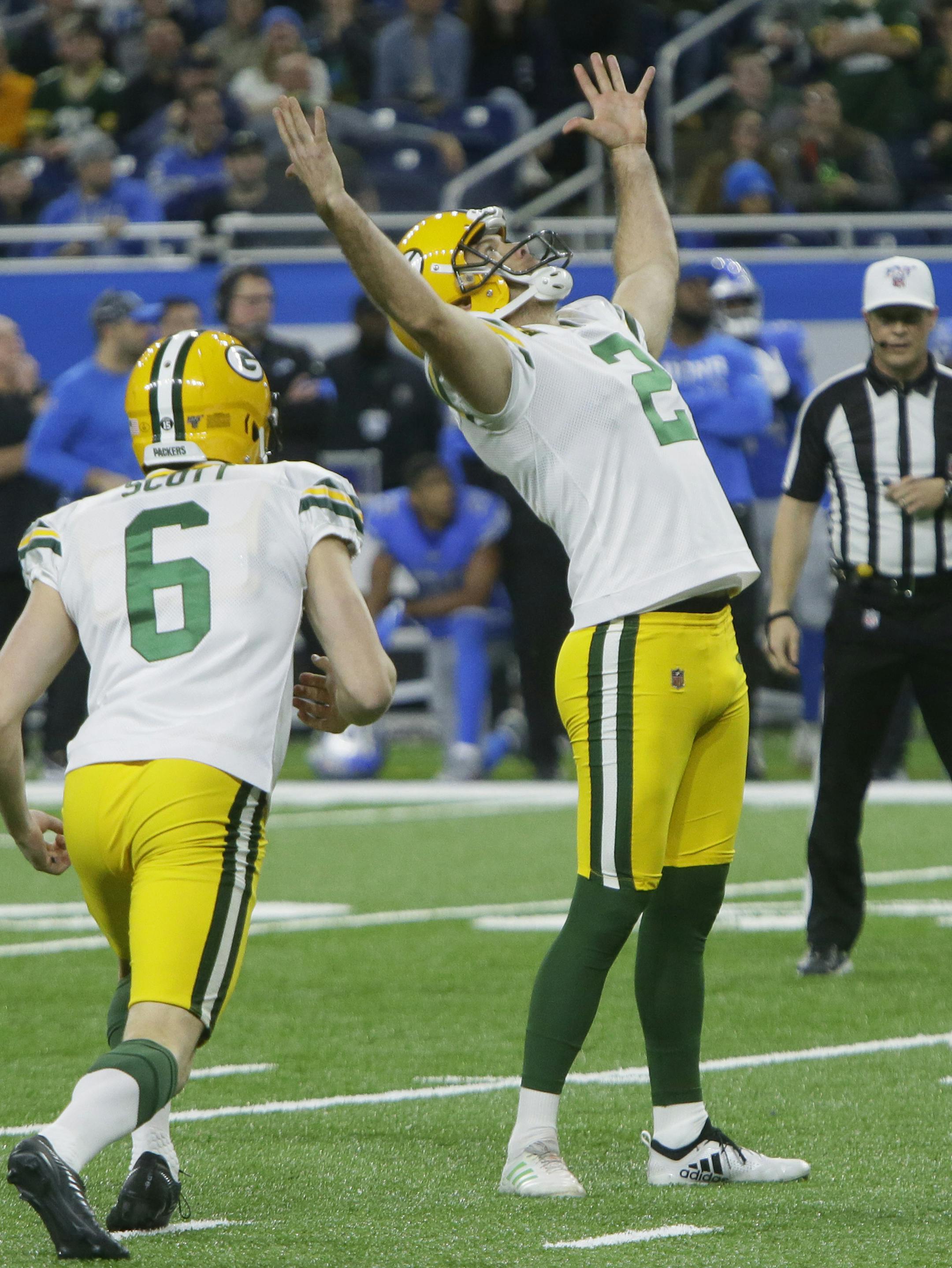 Green Bay Packers kicker Mason Crosby (2) raises his arms after kicking the winning field goal during the second half of an NFL football game against the Detroit Lions, Sunday, Dec. 29, 2019, in Detroit. (AP Photo/Duane Burleson)