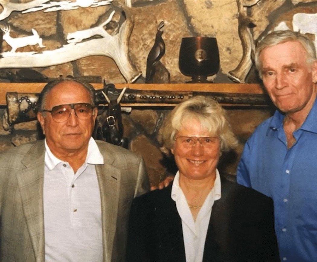 Chuck Delaney, left, his late wife, Loral I, and actor Charlton Heston, a friend who also enjoyed target shooting and hunting.