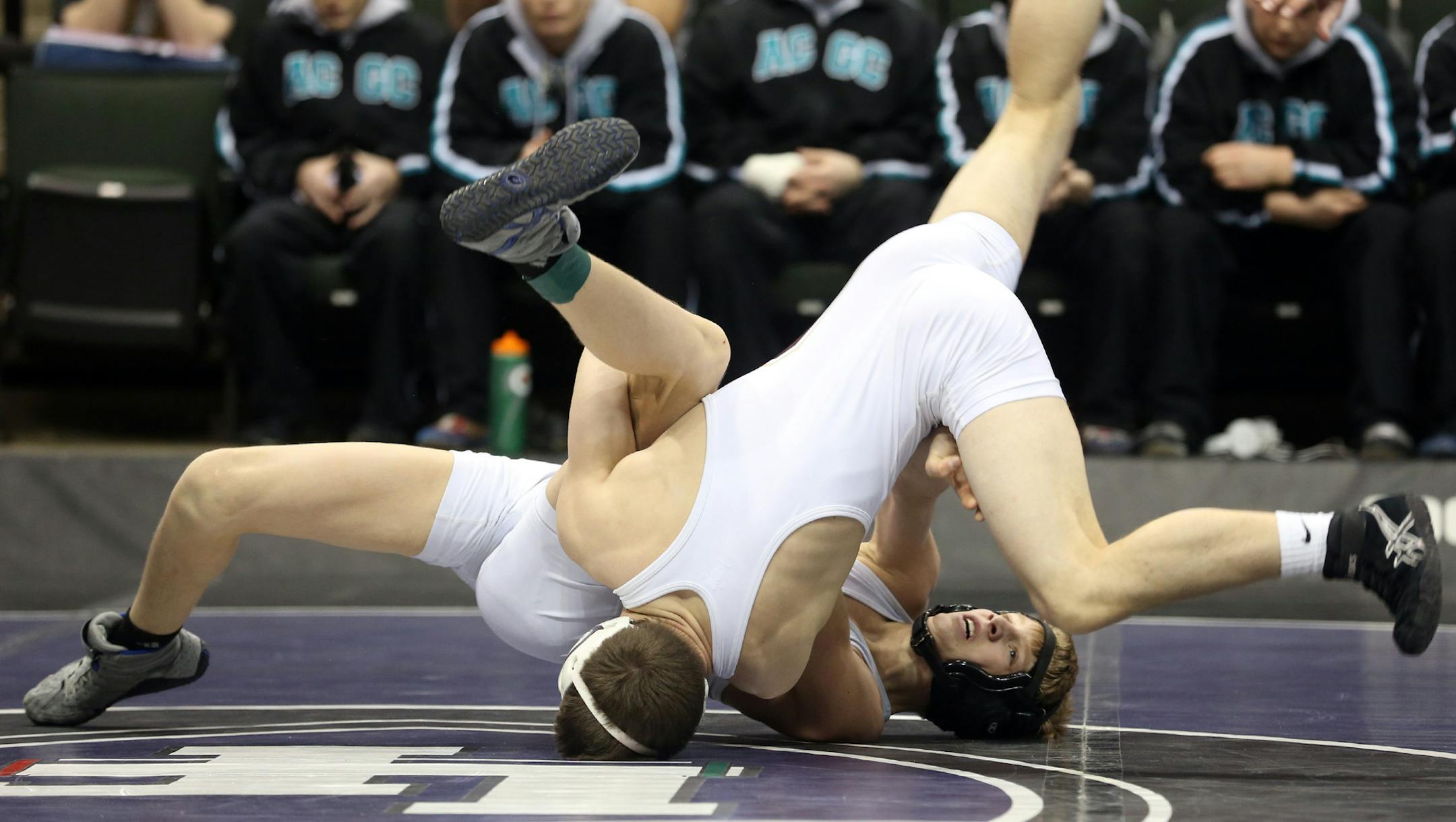 Chatfield's Jared Goldsmith flipped over the top of ACGC's Brennan Holien during the 113 weight class ] (KYNDELL HARKNESS/STAR TRIBUNE) kyndell.harkness@startribune.com - 1A team State wrestling tournament at the Xcel Energy Center in St. Paul Thursday, February 27, 2014.